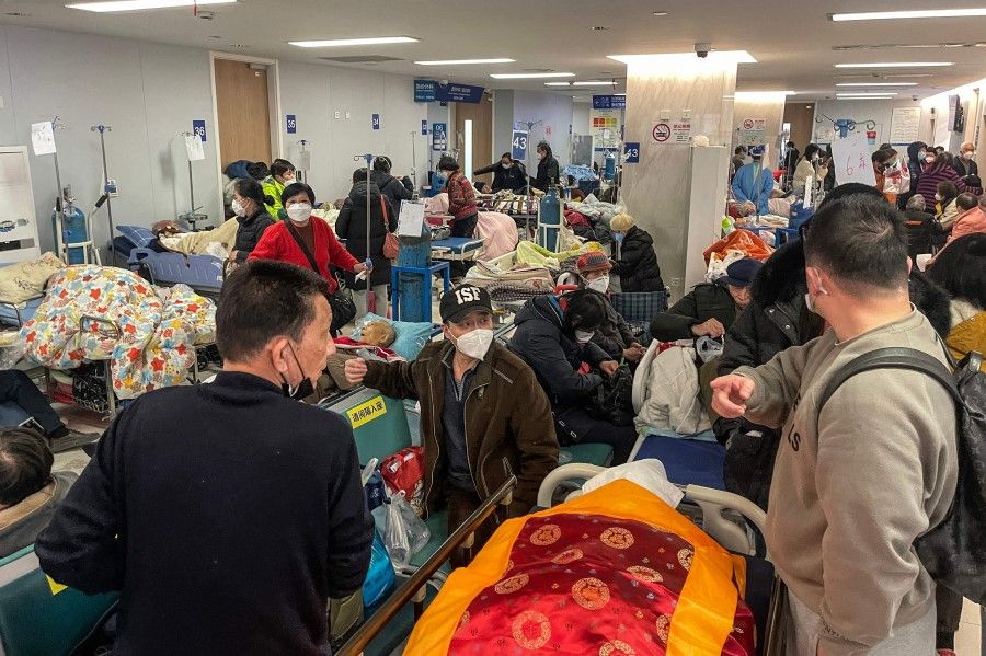 Patients on stretchers are seen at Tongren hospital in Shanghai on 3 January 2023. (Hector Retamal/AFP)