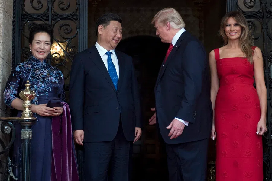 US First Lady Melania Trump and US President Donald Trump welcome Chinese President Xi Jinping and his wife Peng Liyuan to the Mar-a-Lago estate in West Palm Beach, Florida, on 6 April 2017.