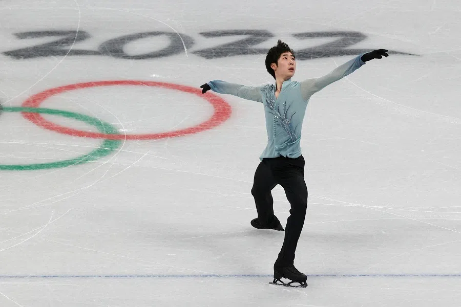 Chinese figure skater Boyang Jin skates during a figure skating training session for the Beijing 2022 Winter Olympics at Capital Indoor Stadium in Beijing, China, 28 January 2022. (Tyrone Siu/Reuters)