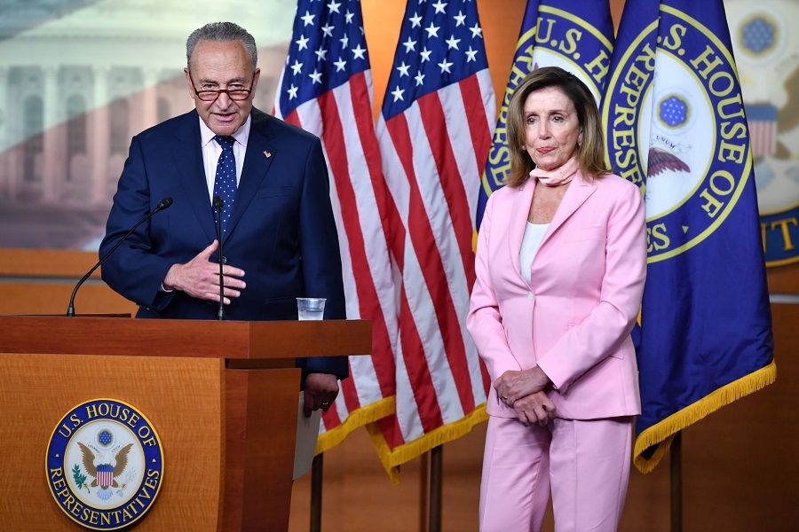 Senate Minority Leader Chuck Schumer (left), Democrat of New York, joins US Speaker of the House, Nancy Pelosi, Democrat of California, during her weekly press briefing on Capitol Hill in Washington, DC, on 23 July 2020. (Nicholas Kamm/AFP)
