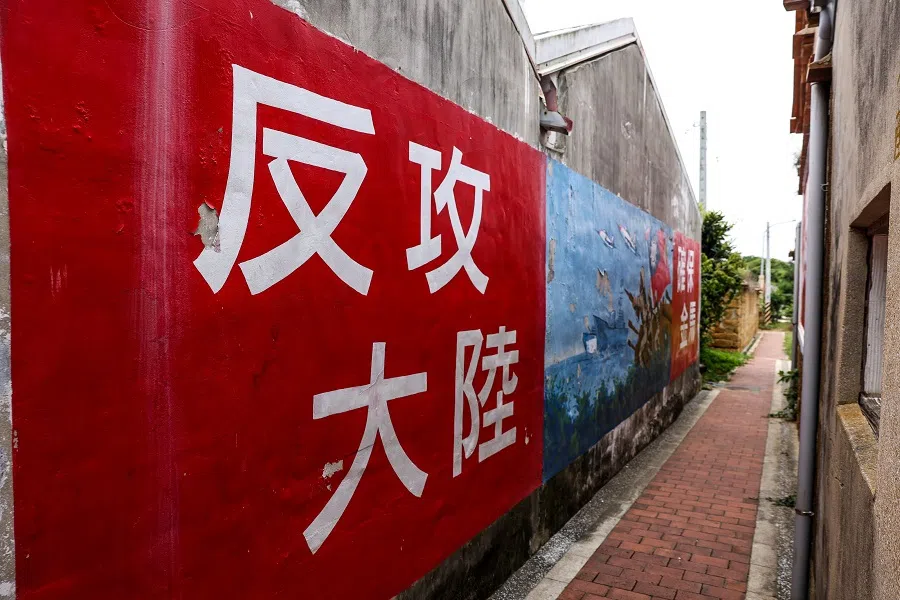 A mural that reads “Go and Reclaim Mainland China” is seen at Yangzhai Old Street in Kinmen, Taiwan, on 19 May 2024. (I-Hwa Cheng/AFP)