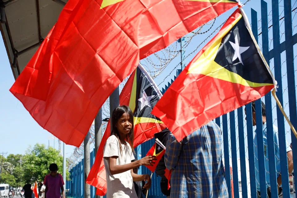 A child selling flags in Dili, capital of Timor-Leste on 13 June 2025. (SPH Media)