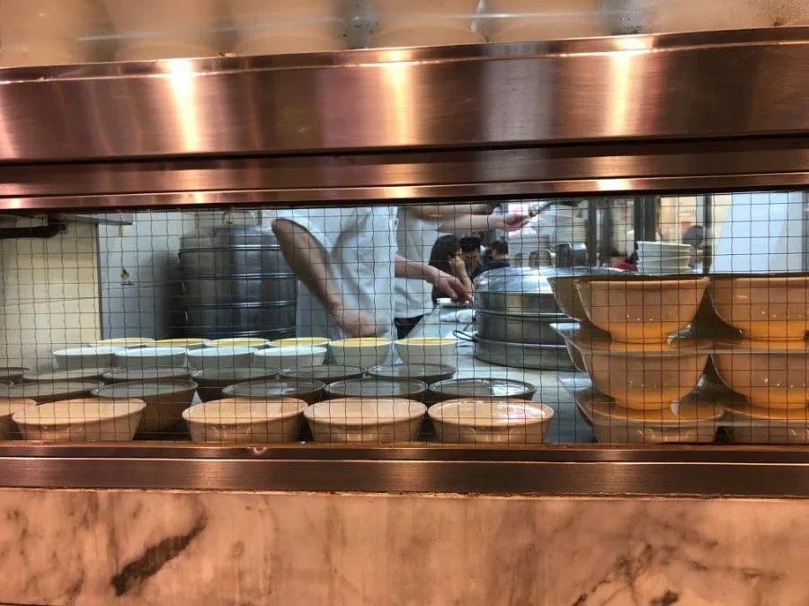 Cantonese steamed milk pudding (双皮奶) in the window of a cha chaan teng in Tsim Sha Tsui, Hong Kong. (Candice Chan/SPH Media)