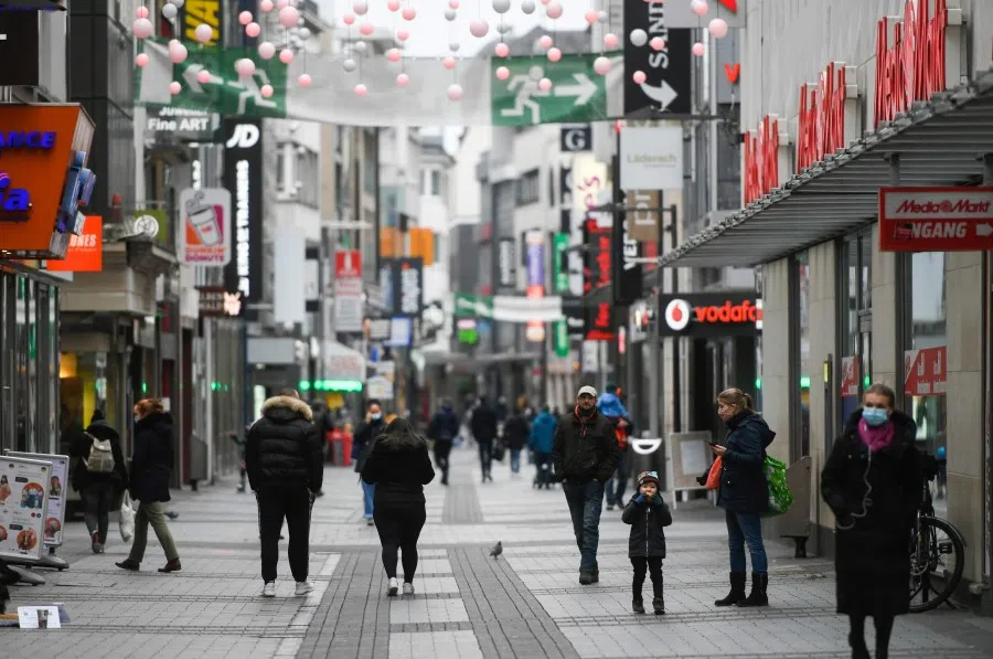 People walk through a pedestrian area in Cologne, western Germany on 4 January 2021 amid the ongoing novel coronavirus / COVID-19 pandemic. (Ina Fassbender/AFP)