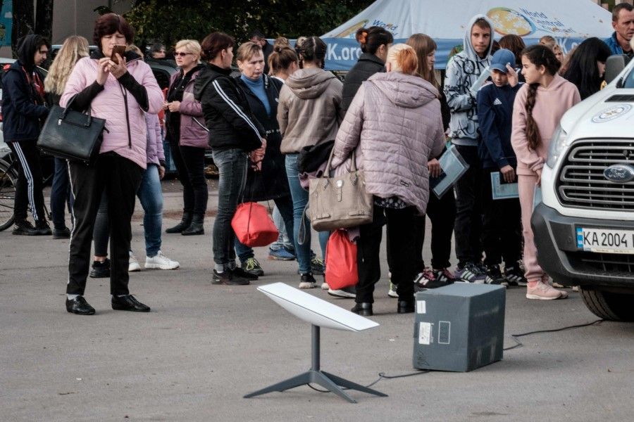 A Starlink satellite-based broadband system is seen at a mobile passport application station installed by the State Migration Service in Shevchenk, Kharkiv region, on 29 September 2022. (Yasuyoshi Chiba/AFP)