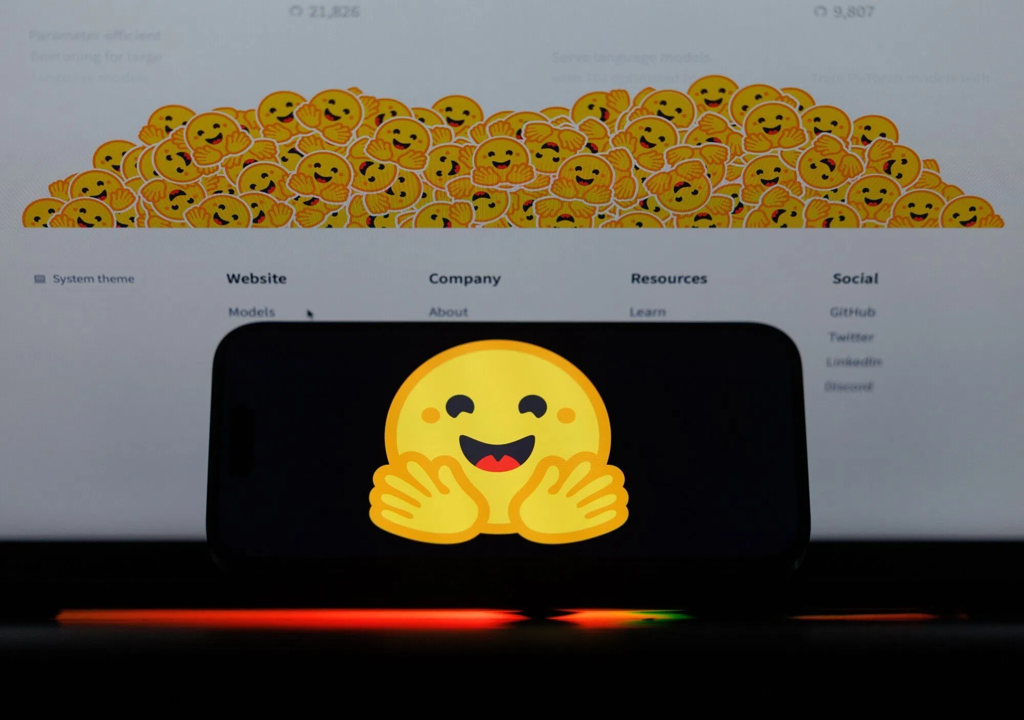The logo of Hugging Face Inc. on a smartphone and laptop, taken on 9 August 2026.
