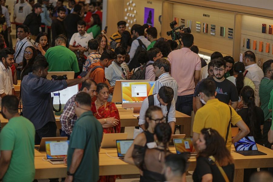 Customers inside the new Apple Inc. store in Mumbai, India, on 18 April 2023. (Dhiraj Singh/Bloomberg)