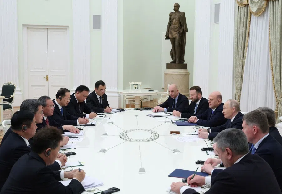 Russian President Vladimir Putin and Chinese Premier Li Qiang attend a meeting at the Kremlin in Moscow on 18 November 2025. (Ramil Sitdikov/AFP)