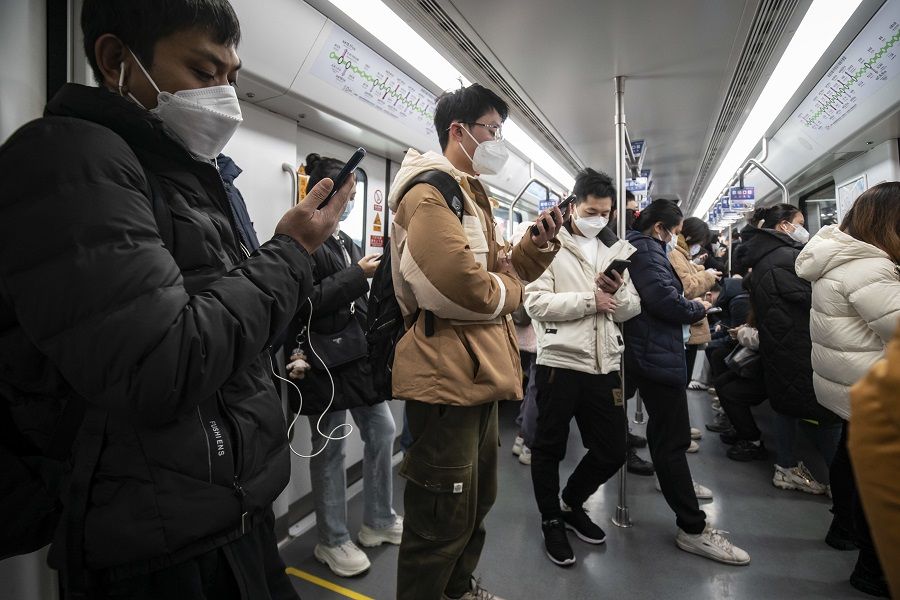 Commuters ride a subway train in Shanghai, China, on 3 January 2023. (Qilai Shen/Bloomberg)