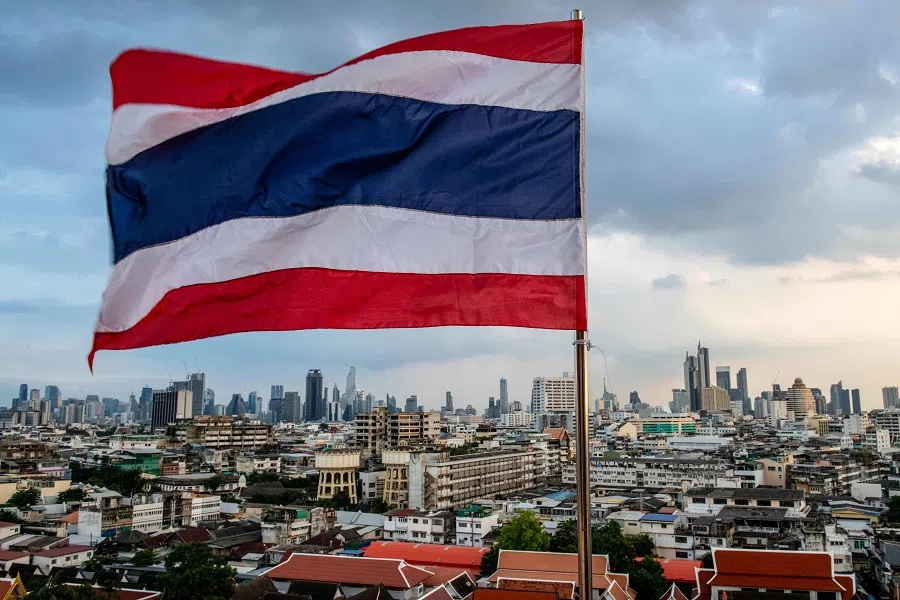Thailand’s national flag flies over the city skyline in Bangkok on 28 October 2024.  (Alex Ogle/AFP)
