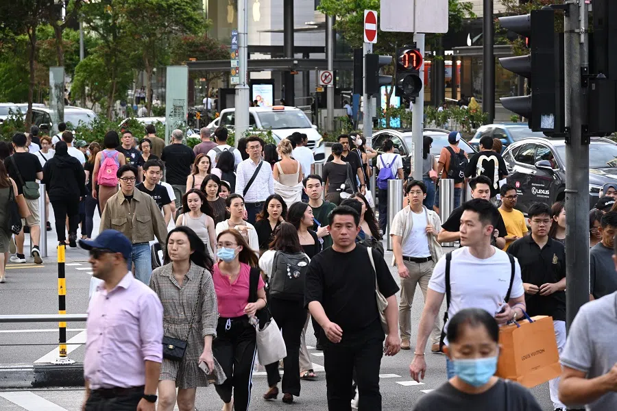 People walking along Orchard Road in Singapore on 27 February 2024. (SPH Media)