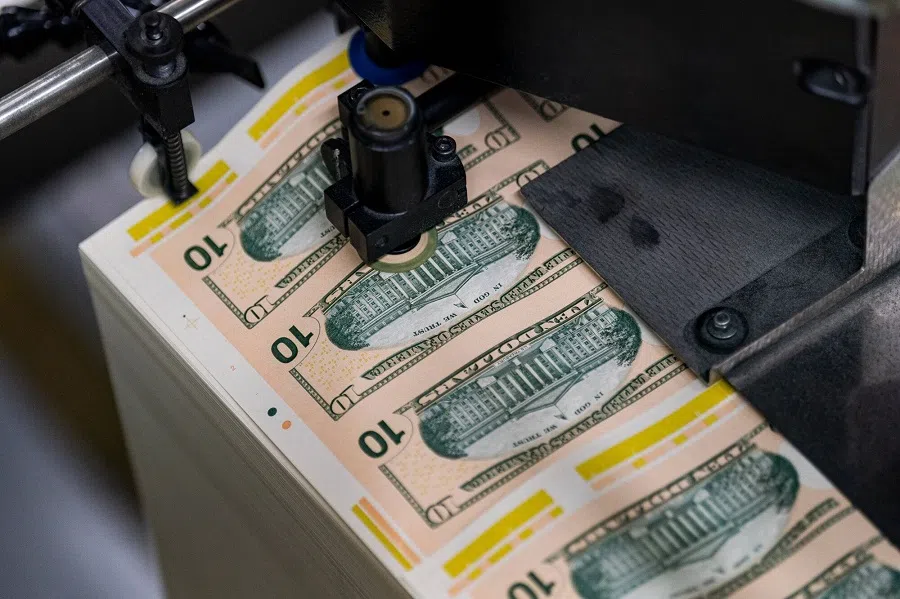 Stacks of US$10 dollar notes move through a machine at the US Bureau of Engraving and Printing in Washington, DC, US, on 21 May 2024. (Al Drago/Bloomberg)