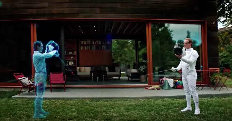 Facebook CEO Mark Zuckerberg is seen fencing in the "Metaverse" with an Olympic gold medal fencer during a live-streamed virtual and augmented reality conference to announce the rebrand of Facebook as Meta, in this screen grab taken from a video released 28 October 2021. (Facebook/Handout via Reuters)