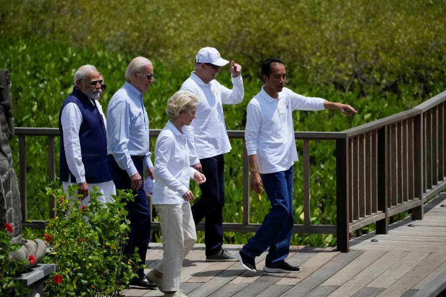 Indonesian President Joko Widodo walks with Indian Prime Minister Narendra Modi, US President Joe Biden, Australian Prime Minister Anthony Albanese and European Commission President Ursula von der Leyen as they visit a mangrove seeding area as part of the G20 Summit in Denpasar, Bali, Indonesia, 16 November 2022. (Dita Alangkara/Pool via Reuters)
