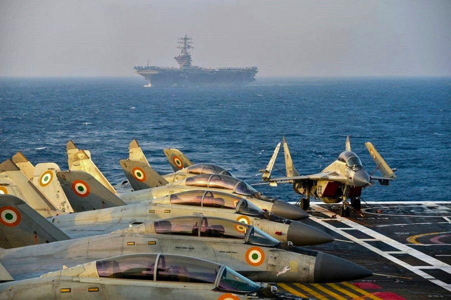 This handout file photo taken and released by the Indian Navy on 18 November 2020 shows Indian army fighter jets on the deck on an aircraft carrier during the second phase of the 2020 Malabar naval exercise in the Arabian sea involving India, Australia, Japan and the US (the Quad). (Indian Navy/AFP)