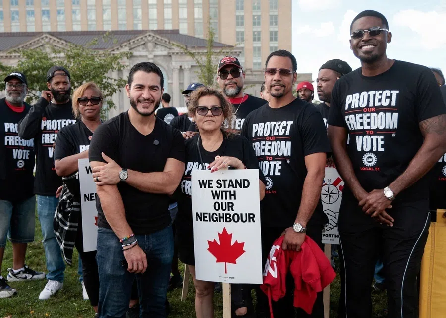 Democratic candidate for US Senate Abdul El-Sayed poses with union members from UAW Local 51 during the Labor Day Parade in Detroit, Michigan, US, 7 September 2026.