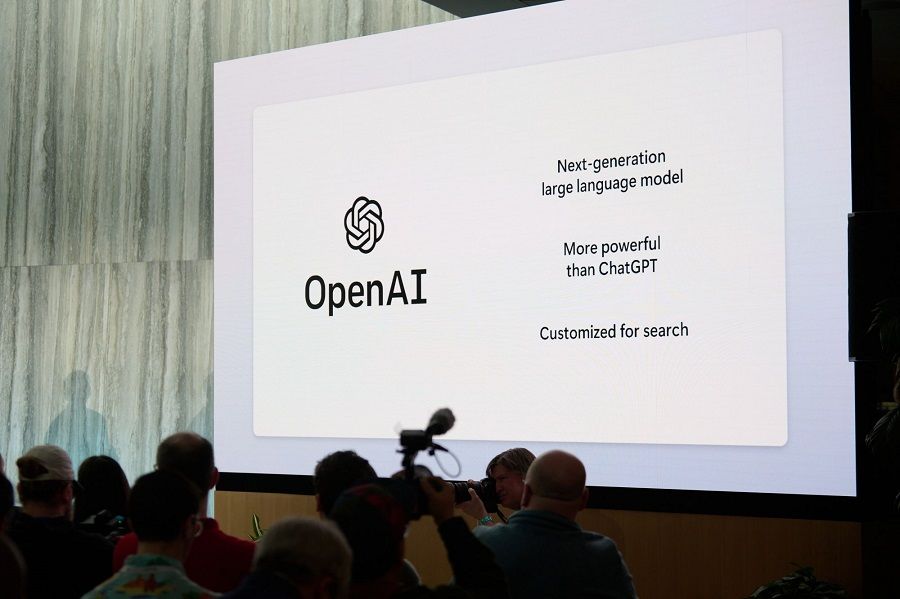 OpenAI signage on a monitor during an event at the Microsoft Corp. headquarters in Redmond, Washington, US, on 7 February 2023. (Chona Kasinger/Bloomberg)