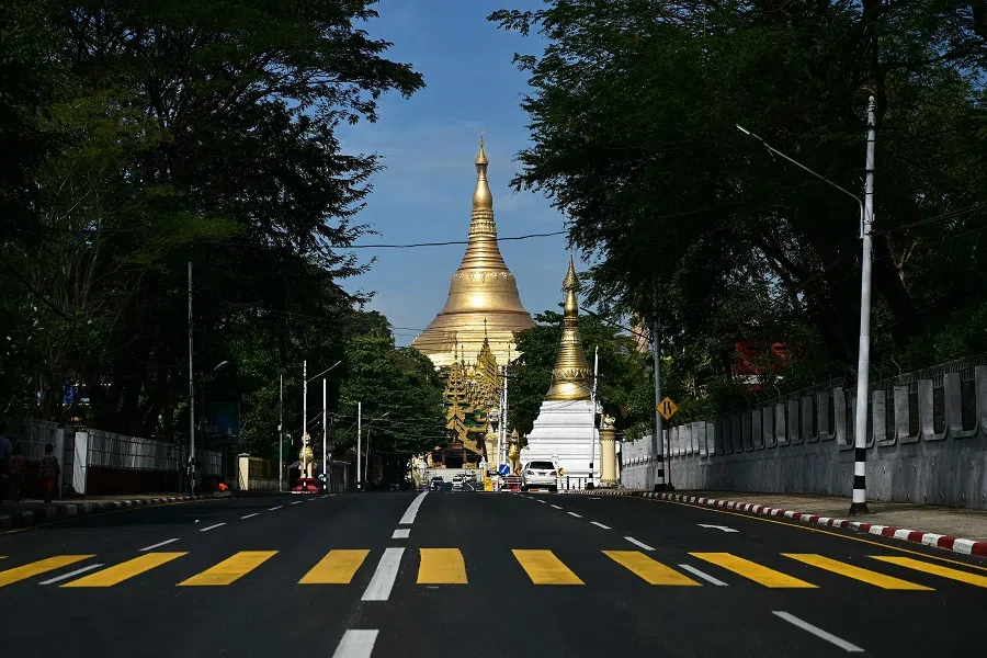 An almost empty street is pictured near the Shwe Dagon Pagoda during a "silent strike" to protest and to mark the third anniversary of the military coup in Yangon on 1 February 2024. (AFP)