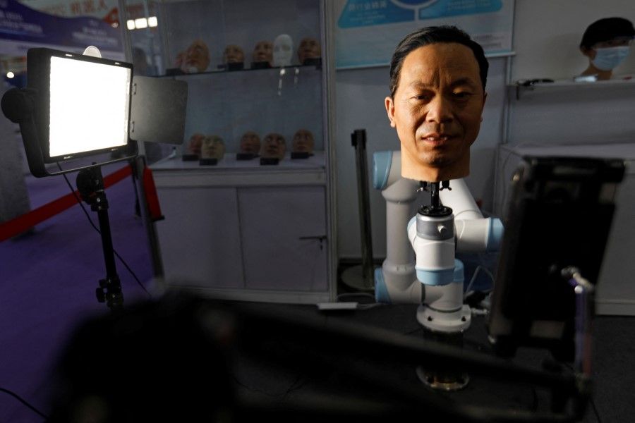 A 3D-printed face on a robotic arm is displayed at the booth of a company that tests facial recognition technologies, at Security China, an exhibition on public safety and security, in Beijing, China, on 7 June 2023. (Florence Lo/Reuters)