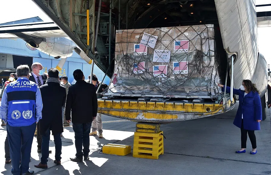 View of boxes containing some of 1,008,000 doses of US Johnson & Johnson vaccines against Covid-19 donated through the COVAX mechanism, upon their arrival at the Air Force base in El Alto, Bolivia, on 11 July 2021. (Aizar Raldes/AFP)