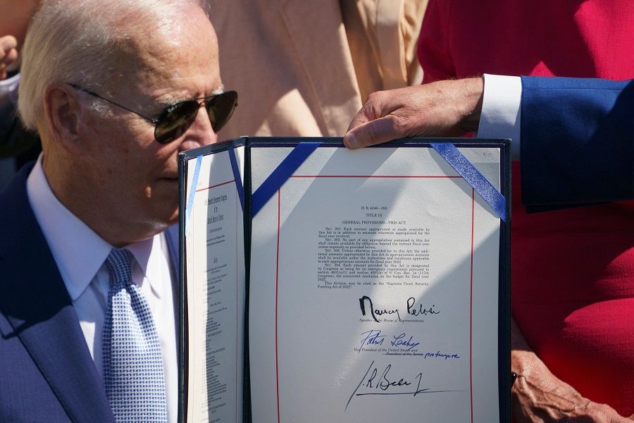 The CHIPS and Science Act of 2022, is displayed after it was signed by US President Joe Biden on the South Lawn of the White House in Washington, DC, US, on 9 August 2022. (Mandel Ngan/AFP)