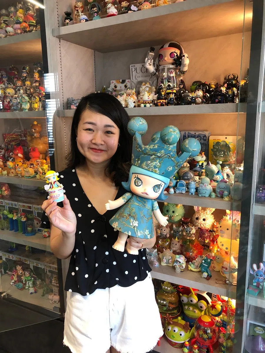 Blind box enthusiast Xuan Weijun with her collection of collectibles. (SPH Media)
