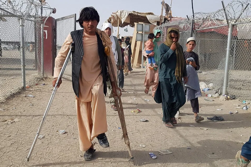 Afghan nationals return back to Afghanistan from the Pakistan-Afghanistan border crossing point in Chaman on 17 August 2021. (AFP)