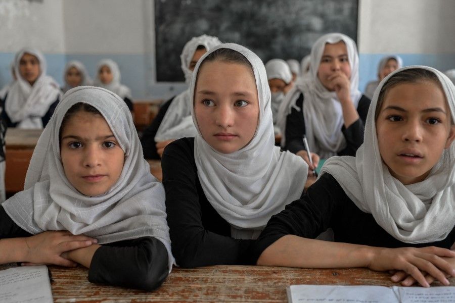 Afghan girls attend a class in a school in Kandahar on 26 September 2021. (Bulent Kilic/AFP)