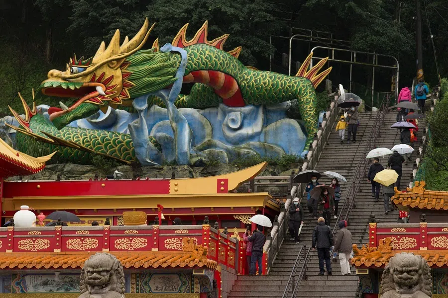 People at the Hongludi Nanshan Fude Temple in New Taipei City, Taiwan, on 24 January 2023. (Sam Yeh/AFP)