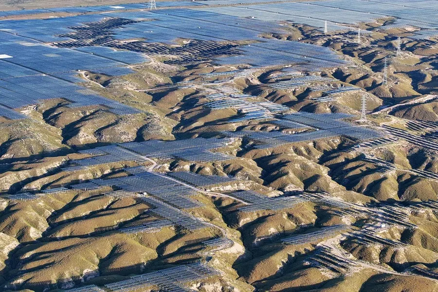 Solar panels are seen on hilltops at the Yinchuan Fourth Photovoltaic Power Station in Yinchuan, in China’s northern Ningxia region on 24 September 2025.