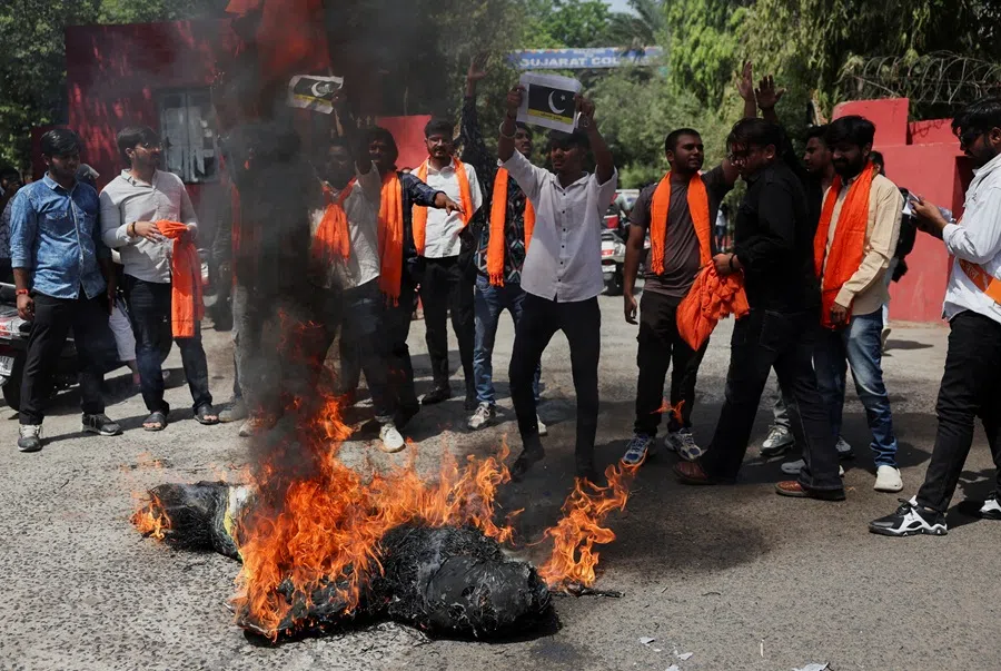 Activists from Vishwa Hindu Parishad (VHP) and Bajrang Dal burn an effigy of terrorism and burn the Pakistan national flag during a protest against the killing of tourists by militants near Pahalgam, in Ahmedabad, India, on 28 April 2025. (Amid Dave/Reuters)