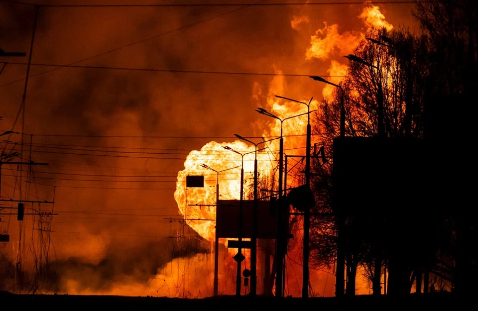 A gas station burns after Russian attacks in the city of Kharkiv, Ukraine, on 30 March 2022. (Fadel Senna/AFP)