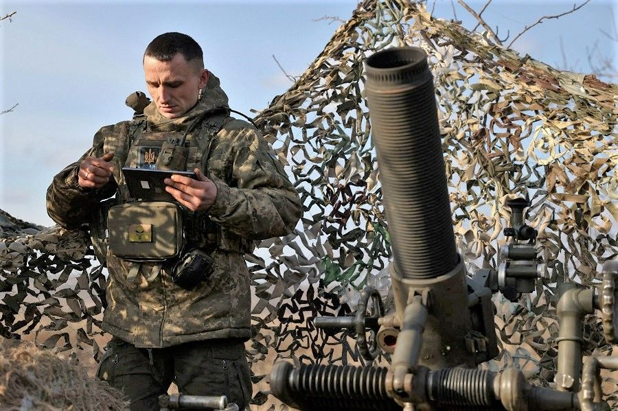 A Ukrainian soldier of the 10th Separate Mountain Assault Brigade "Edelweiss" prepares to fire a French MO-120-RT61 mortar towards Russian positions at a front line in the Donetsk region, Ukraine, on 4 March 2023, amid the Russian invasion of Ukraine. (Anatolii Stepanov/AFP)