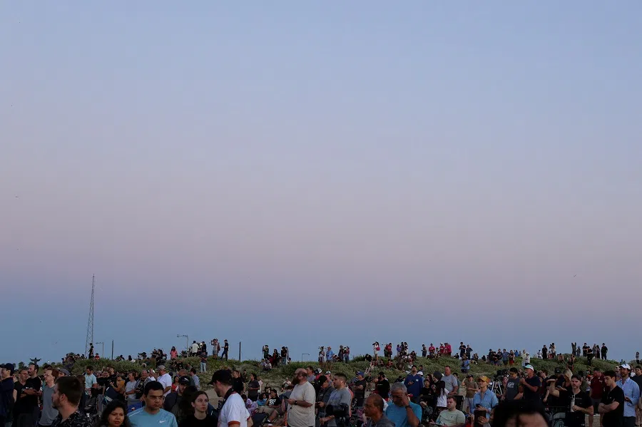 People gather to observe the launch of SpaceX’s Starship during its fifth flight test, in Boca Chica, Texas, US, on 13 October 2024. (Kaylee Greenlee Beal/Reuters)