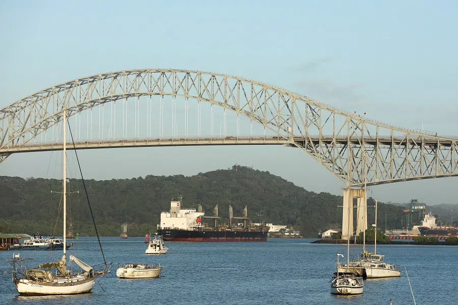 A cargo ship sails near the Bridge of the Americas, which spans the entrance to the Panama Canal, after newly sworn-in US President Donald Trump’s remarks during his inauguration speech, when he vowed that the US would take back the canal, in Panama City, Panama, on 22 January 2025.