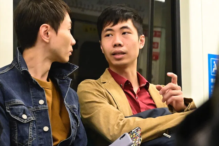 This picture taken on November 13, 2019 shows Hong Kong's Leonardo Wong (R) with his Taiwanese friend in Kaohsiung, southern Taiwan. The ongoing protests in Hong Kong are pushing residents to seek new lives abroad, with many turning to nearby democratic Taiwan. (Sam Yeh/AFP)