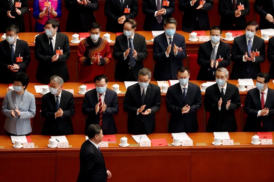 Chinese President Xi Jinping walks past officials wearing face masks following the Covid-19 outbreak as he arrives for the closing session of the National People's Congress at the Great Hall of the People in Beijing, China, on 28 May 2020. (Carlos Garcia Rawlins/Reuters)