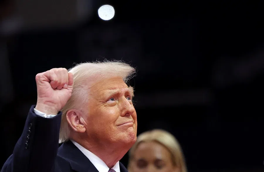 US President Donald Trump gestures during the inaugural parade inside Capital One Arena on the inauguration day of his second presidential term, in Washington, US, on 20 January 2025.