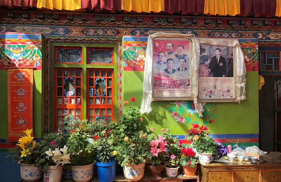 Photos of China's top leaders are hung in the most prominent spot of the living room.