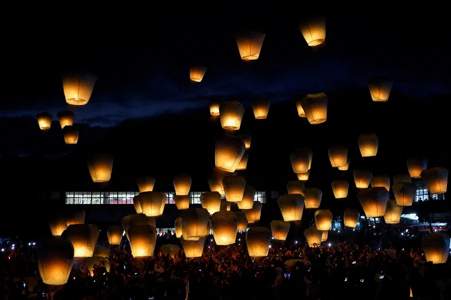 People release sky lanterns in New Taipei city, Taiwan, on 17 February 2024. (Ann Wang/Reuters)