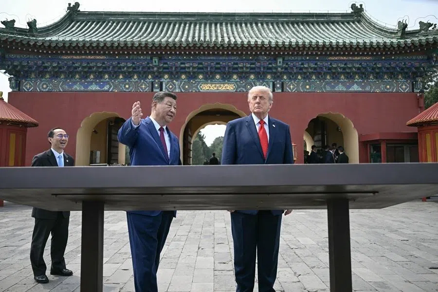 Chinese President Xi Jinping (centre) and US President Donald Trump (right) visit the Temple of Heaven in Beijing on 14 May 2026. (Brendan Smialowski/Pool via Reuters)