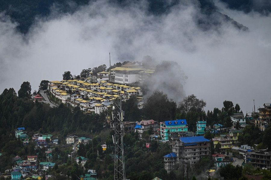 This general view shows a monastery covered with clouds in Tawang near the Line of Actual Control (LAC), neighbouring China, in the northeast Indian state of Arunachal Pradesh on 20 October 2021. (Money Sharma/AFP)