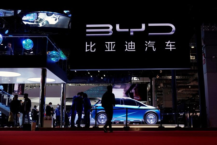 People visit the BYD booth during a media day for the Auto Shanghai show in Shanghai, China, 19 April 2021. (Aly Song/Reuters)