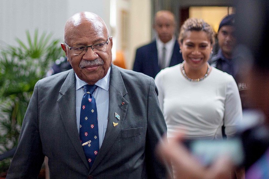Fiji's new prime minister and People's Alliance Party leader Sitiveni Rabuka (centre) leaves after the first sittings of the newly elected parliament in Fiji's capital city Suva on 24 December 2022. (Leon Lord/AFP)