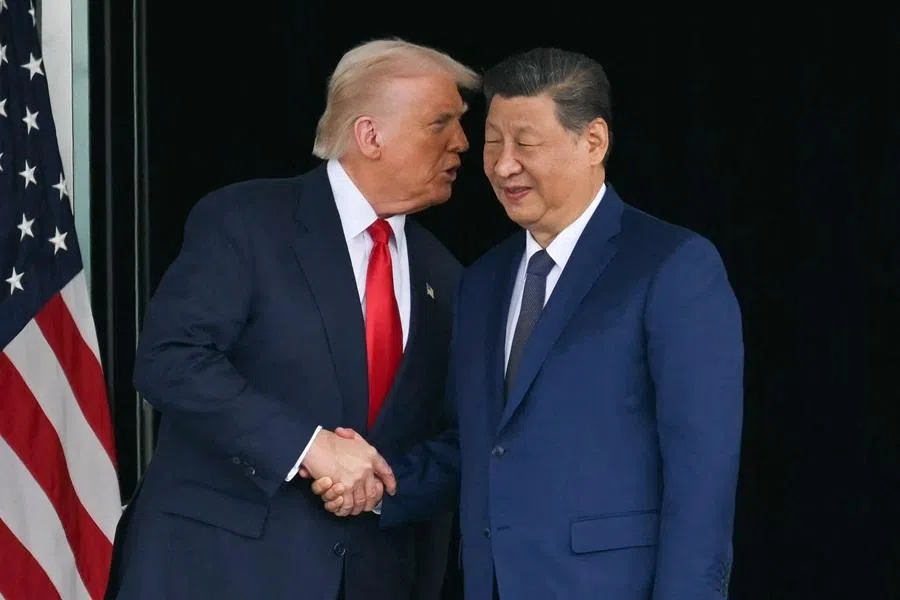 US President Donald Trump and China's President Xi Jinping shake hands as they leave after their talks at the Gimhae Air Base, located next to the Gimhae International Airport in Busan on 30 October 2025.