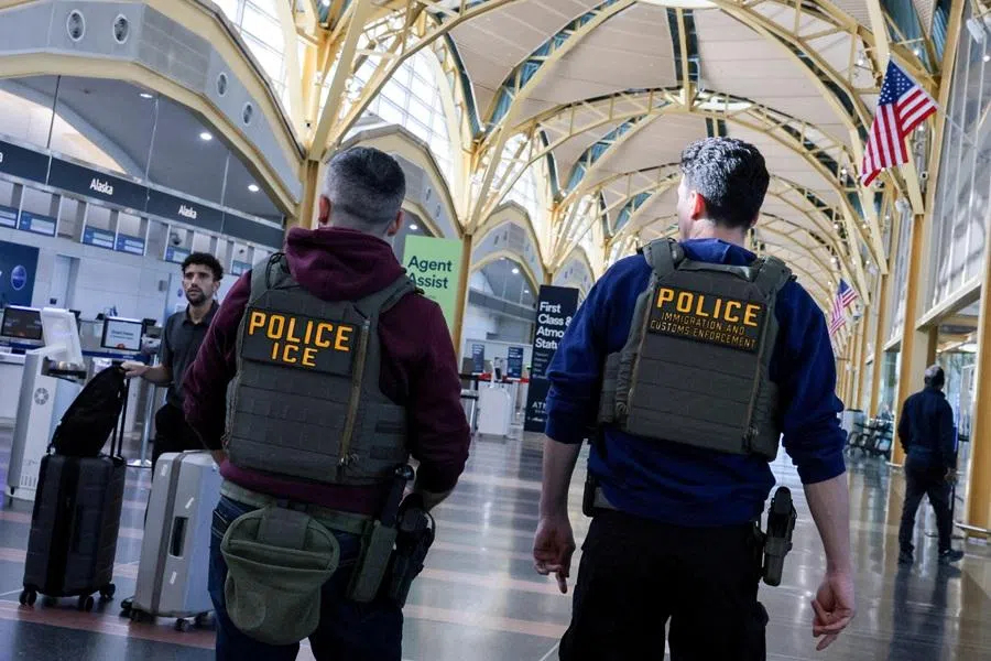 US Immigration and Customs Enforcement (ICE) agents patrol at Washington Reagan National Airport in Arlington, Virginia, US, 24 March 2026. (Jonathan Ernst/Reuters)