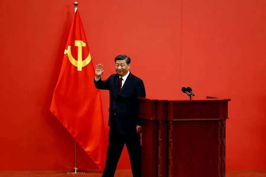 Chinese President Xi Jinping waves after his speech as the new Politburo Standing Committee members meet the media following the 20th National Congress of the Communist Party of China, at the Great Hall of the People in Beijing, China, on 23 October 2022. (Tingshu Wang/Reuters)