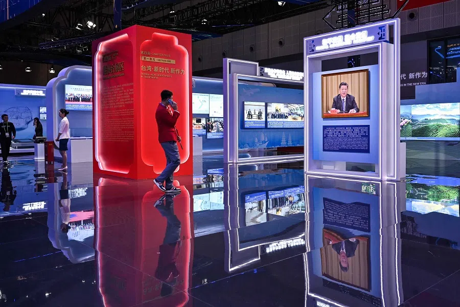 People visit the China stand during the 6th China International Import Expo (CIIE) in Shanghai, China, on 5 November 2023. (Hector Retamal/AFP)