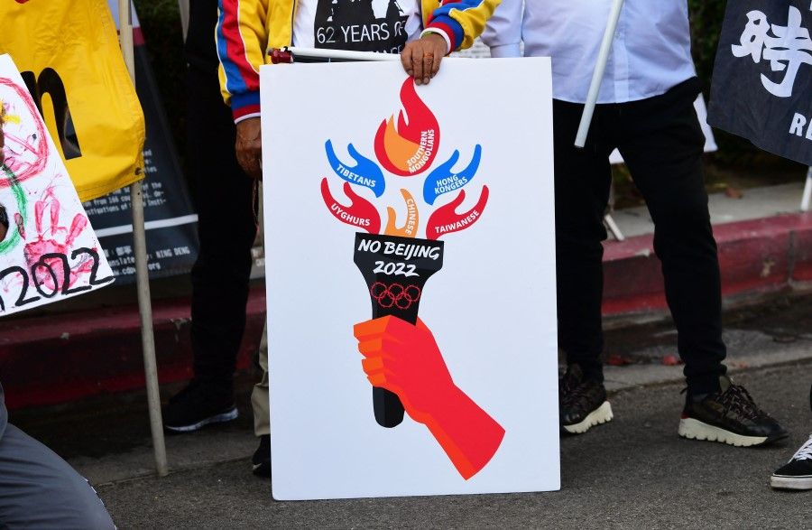 In this file photo taken on 3 November 2021, activists rally in front of the Chinese Consulate in Los Angeles, California, calling for a boycott of the 2022 Beijing Winter Olympics due to concerns over China's human rights record. (Frederic J. Brown/AFP)