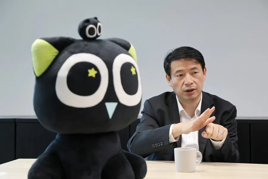 COL president Tong Zhilei is pictured with a plushie of a character from the animated movie The Legend of Hei 2. (SPH Media)
